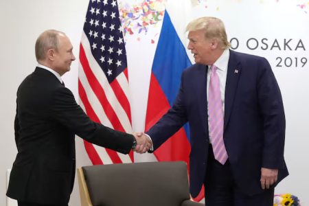 Russia’s President Vladimir Putin shakes hands with U.S. President Donald Trump during a meeting on the sidelines of the G20 summit in Osaka, Japan June 28, 2019.