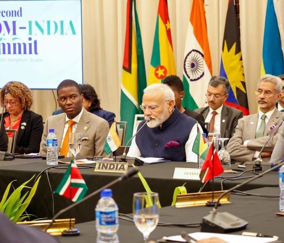 India’s Prime Minister Narendra Modi speaking yesterday. Next to him is the Chairman of CARICOM, Grenadian Prime Minister Dickon Mitchell. (CARICOM photo)