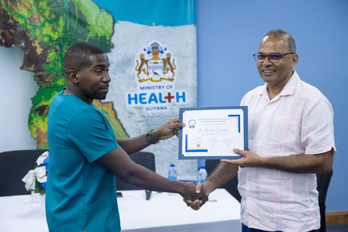 A certificate being presented by Minister of Health, Dr Frank Anthony (Ministry of Health photo)