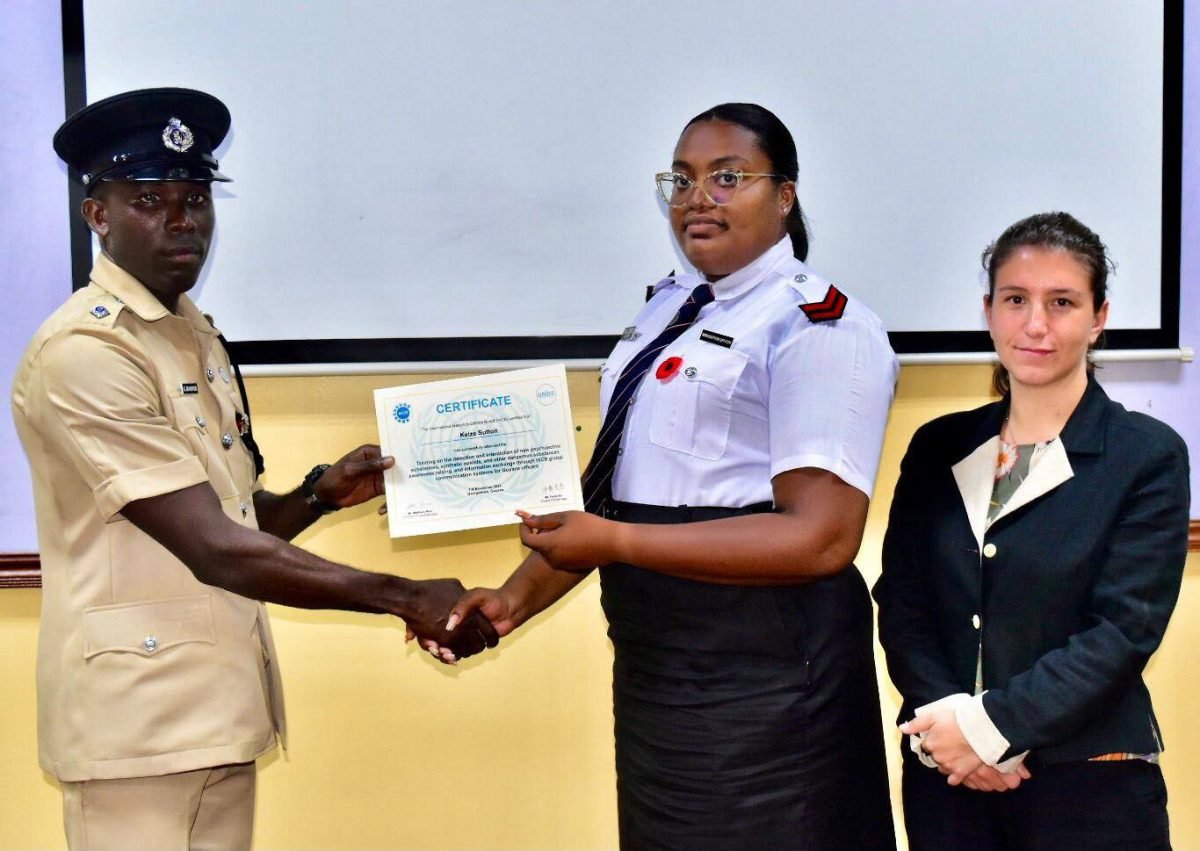 A certificate being handed over (Police photo)