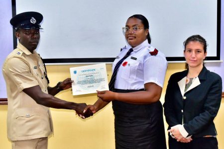 A certificate being handed over (Police photo)