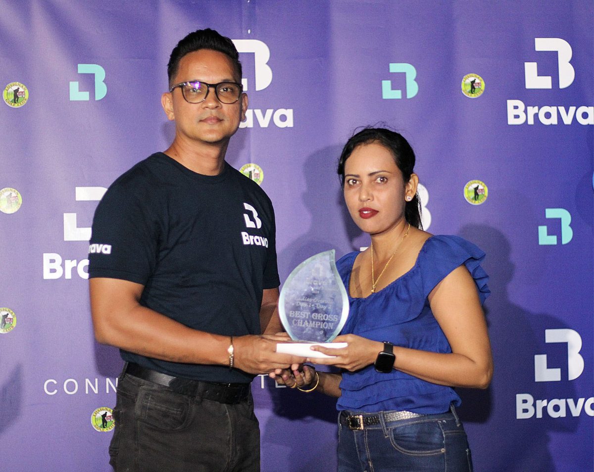 The women’s winner Christine Sukhram was presented with her trophy by Hilton Wong, Sales Manager of Brava