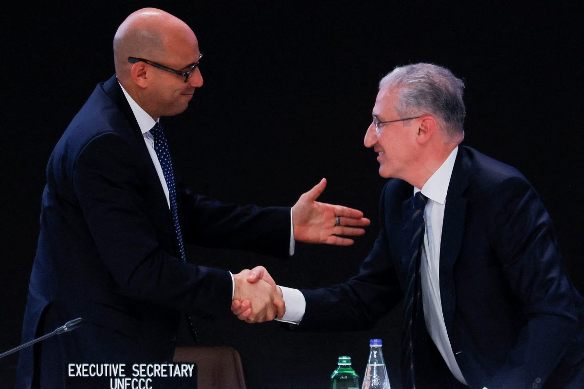 COP29 President Mukhtar Babayev and Simon Stiell, Executive Secretary of UNFCCC, shake hands during the COP29 United Nations Climate Change Conference, in Baku, Azerbaijan November 23, 2024. REUTERS/Maxim Shemetov 