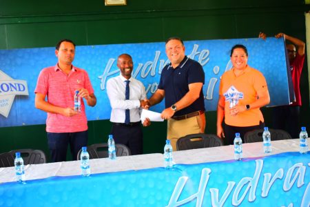 DDL Brand Manager Larry Wills (2nd from left) handed over the sponsorship package to GHB President Philip Fernandes (2nd from right) as two GHB officials look on.