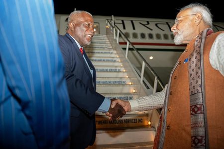  Prime Minister Mark Phillips (left) bidding farewell to Indian Prime Minister Narendra Modi just before he ascended the stairs to the aircraft he arrived on here on Wednesday. Modi had a packed schedule which included the CARICOM-India Summit and bilateral talks with Guyana. It was the first visit by a sitting Indian Prime Minister since 1968. (Office of the Prime Minister photo) 