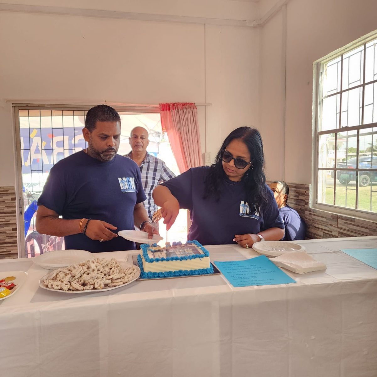 Geree (Gigi) Misir Dwarkaprasad and her husband Mahesh (Vishal) Dwarkaprasad cutting the cake to officially open the business.