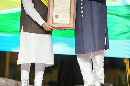 Indian Prime Minister Narendra Modi (left)  was conferred on Wednesday night by President Irfaan Ali with  Guyana’s highest national honour, the Order of Excellence.  (Office of the President photo)