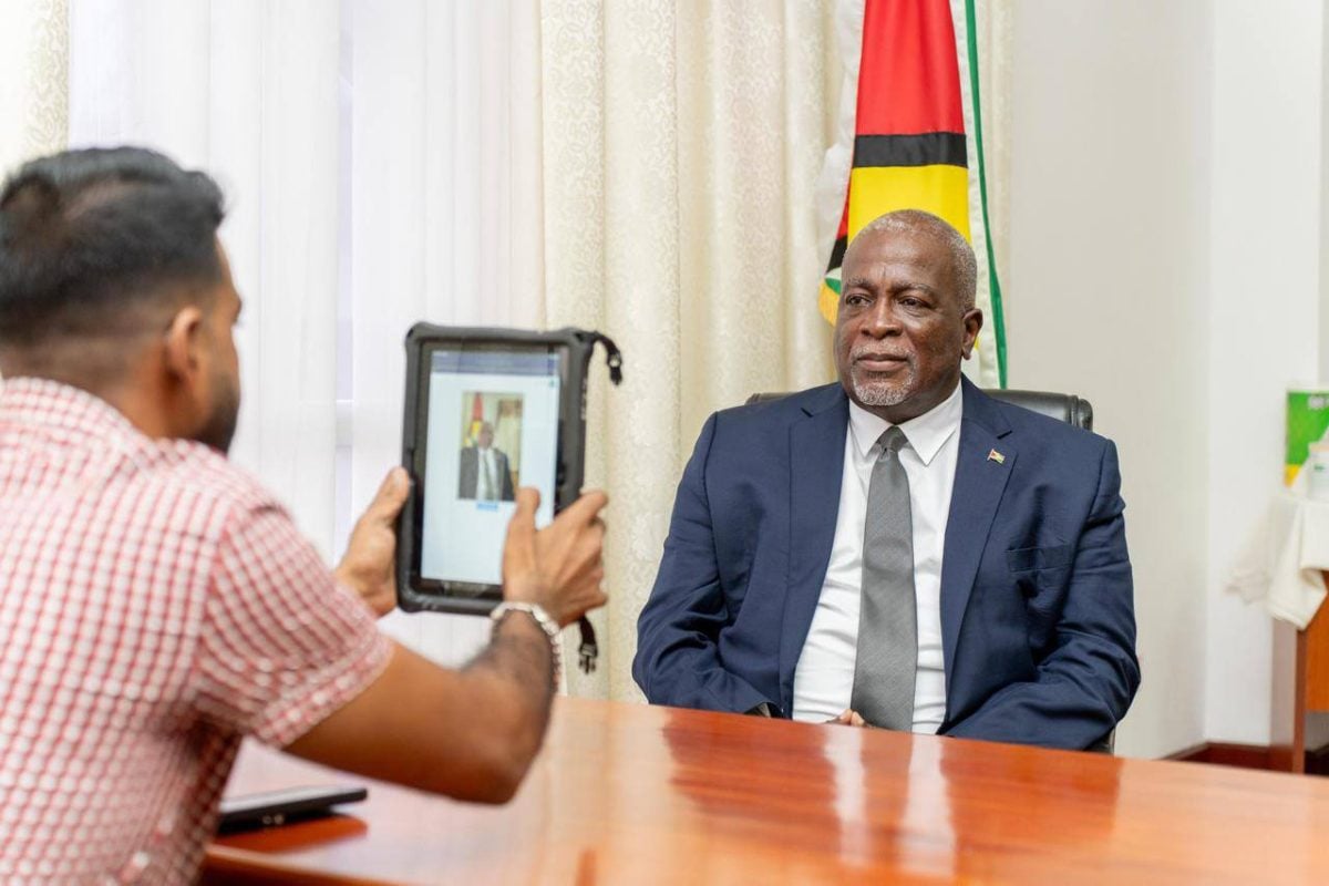 Prime Minister Mark Phillips being registered for the cash grant (Office of the Prime Minister photo)