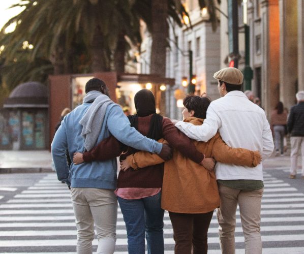 Often those who people watch tend to wonder about the lives of those they see going by (AI generated image of a group of friends walking along together)