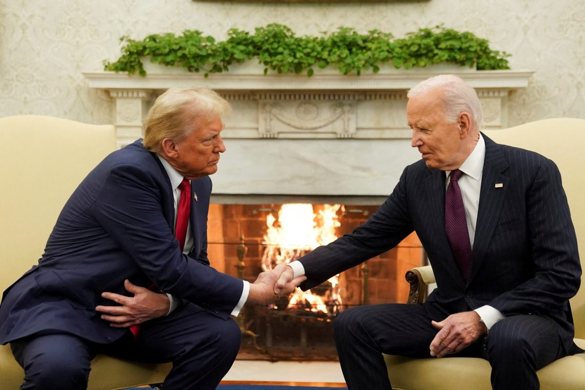 U.S. President Joe Biden (right) meets with President-elect Donald Trump in the Oval Office at the White House in Washington, U.S., November 13, 2024. REUTERS/Kevin Lamarque