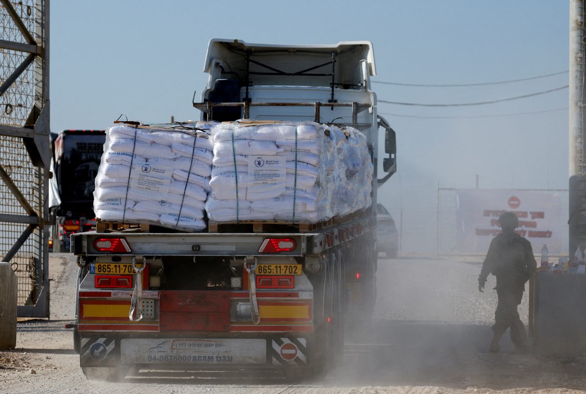 FILE PHOTO: A truck carries humanitarian aid destined for the Gaza Strip, amid the ongoing conflict in Gaza between Israel and Hamas, at the Kerem Shalom crossing in southern Israel, November 11, 2024. REUTERS/Amir Cohen/File Photo