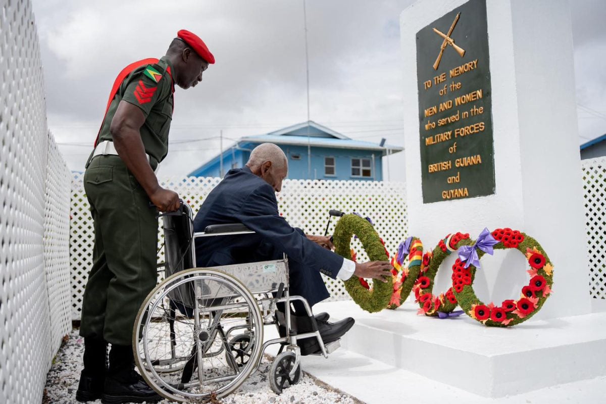 A veteran laying a wreath yesterday at the Veterans Monument on the Front Lawns of Base Camp Ayanganna. (Office of the Prime Minister photo)