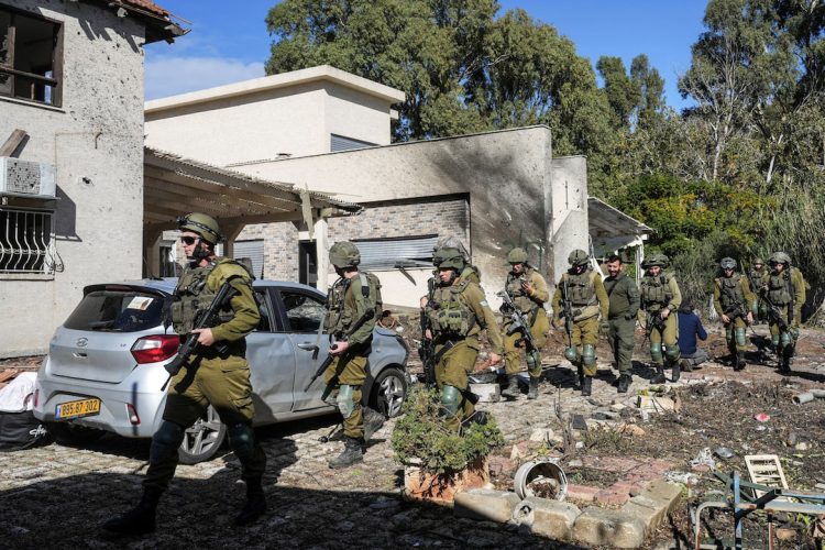 Israeli soldiers visit the site where a house was damaged, after Israel’s military reported projectiles crossing over to Israel from Lebanon, amid hostilities between Hezbollah and Israeli forces, November 26, 2024. REUTERS/Ayal Margolin