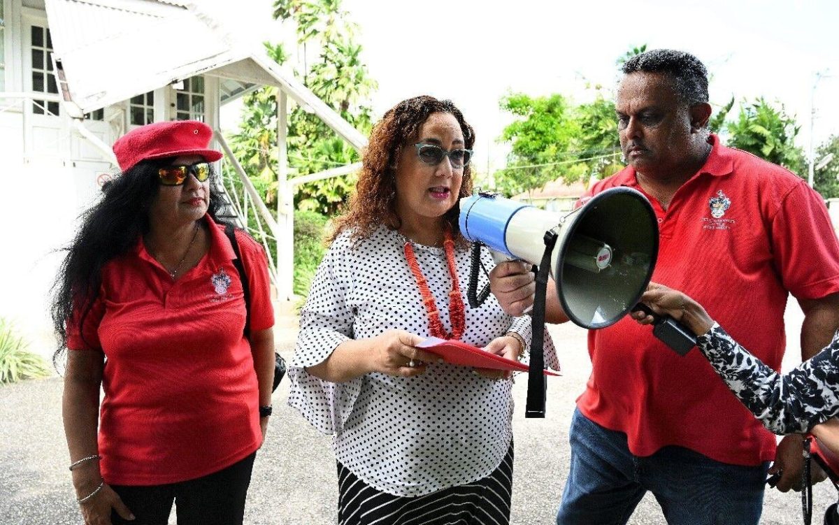 `Hands tied’: Pro Vice-Chancellor and principal of the St Augustine campus of The University of the West Indies Prof Rose-Marie Belle Antoine, centre, speaks alongside WIGUT president Dr Indira Rampersad and vice-president Dr Russel Ramsewak at a salary protest, “Tempestuous Thursday”, at the campus yesterday.