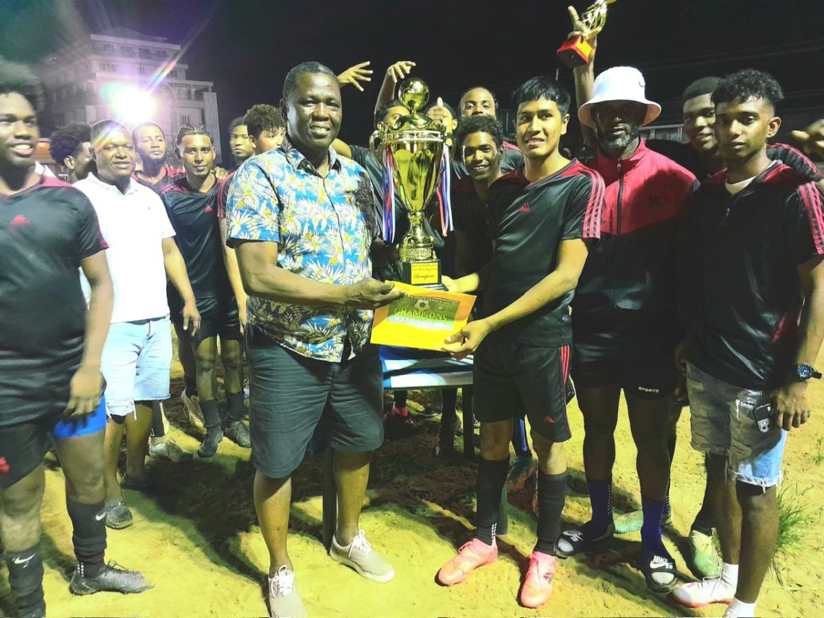 Potaro Strikers receives the championship trophy after
winning the Bartica Football Association Senior Men’s League.
