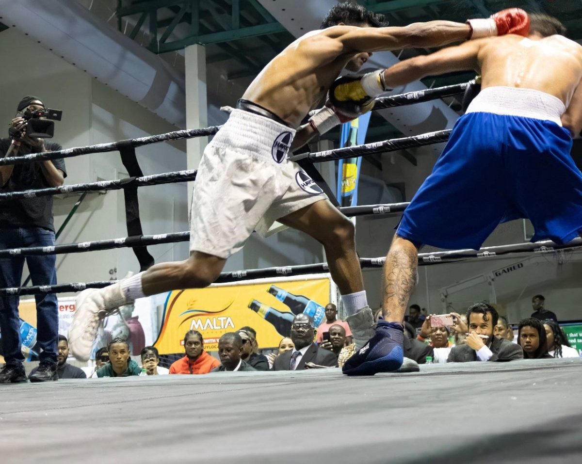 Headshot! Elton Dharry lands a straight right to the head of Colombian Randy Ramirez during their bout (Athletedge Photo)
