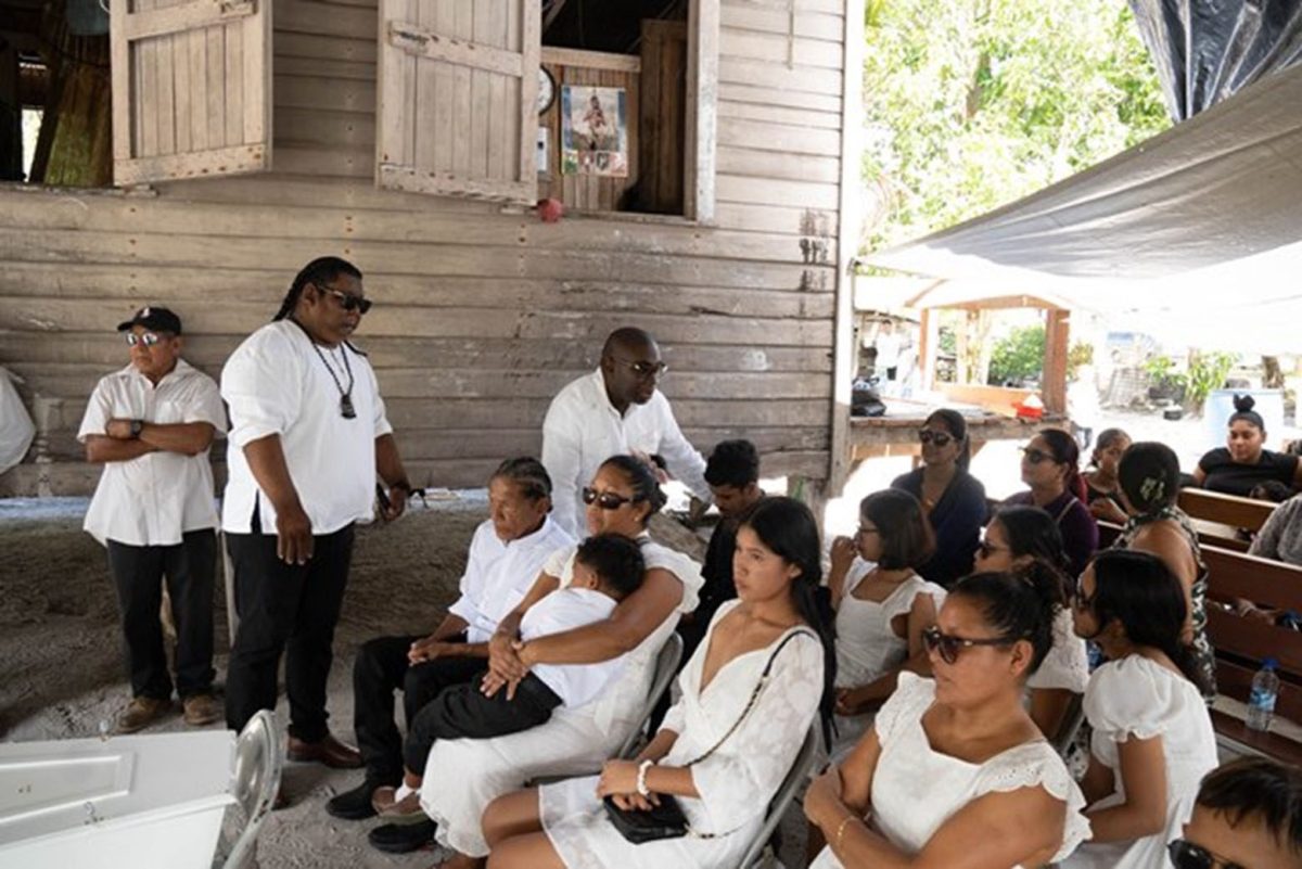 Minister within the Office of the Prime Minister with responsibility for Public Affairs, Kwame McCoy and Toshao of St Cuthbert’s Mission, Alvoro Simon comforting the family of the victims (DPI photo)