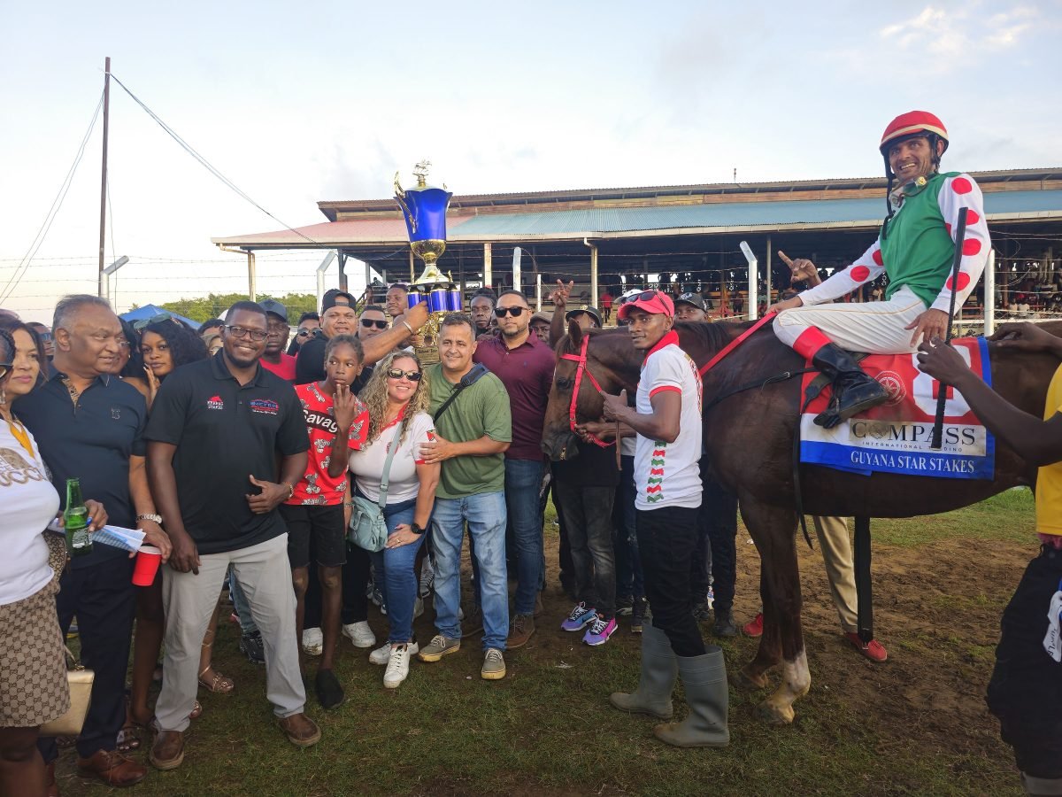 Officials and supporters of Olympic Kremlin celebrate after winning the feature event.