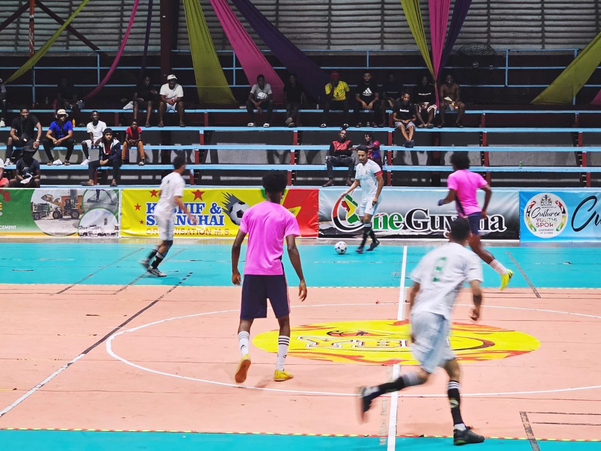 A moment in the Road Warriors (white) and Foot Steppers match in the Kashif and Shanghai National Futsal Championship.