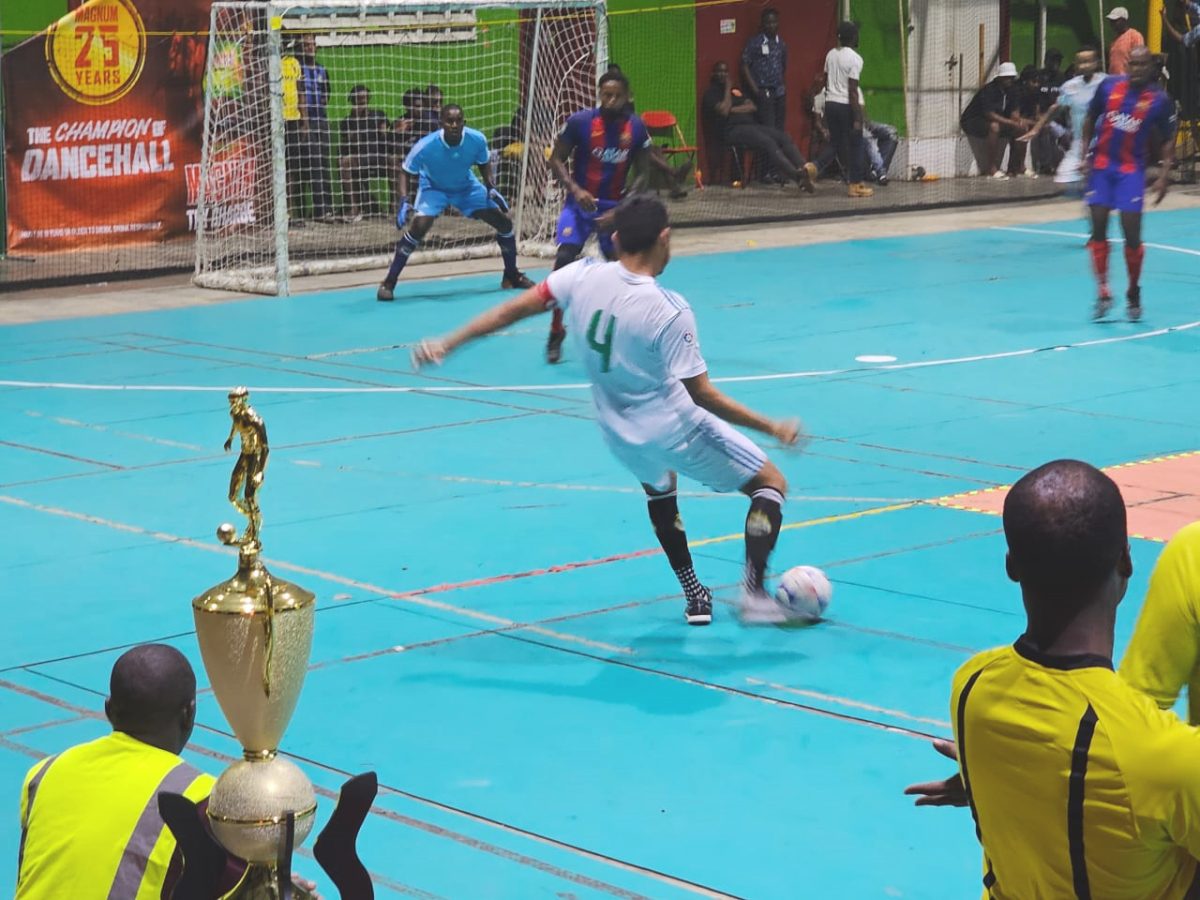 Action in the Kashif and Shanghai National Futsal Championship between Road Warriors (white) and Ballers of Berbice
