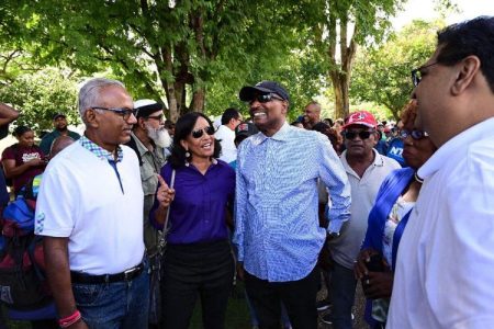 Looking on at right is Mayaro MP Rushton Paray