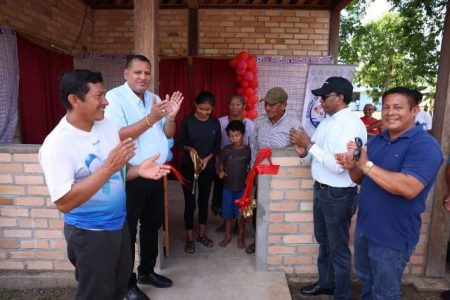 Minister Collin Croal (second from left) handing over a house in Crashwater