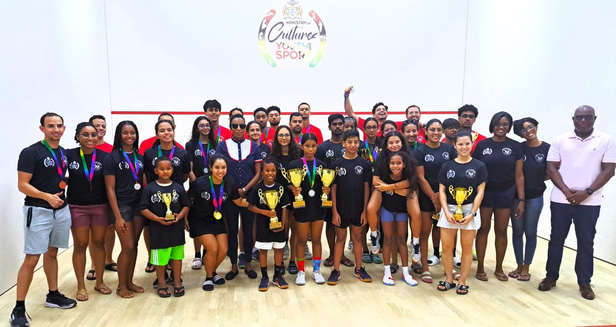 The respective divisional winners and top three finishers pose with their spoils following the conclusion of the President’s Cup Squash Championship