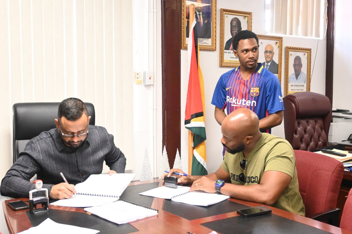 One of the contracts being signed (Ministry of Home Affairs photo)