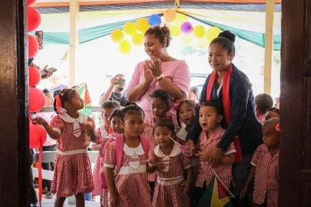 Nursery pupils cutting the ribbon to commission the new school