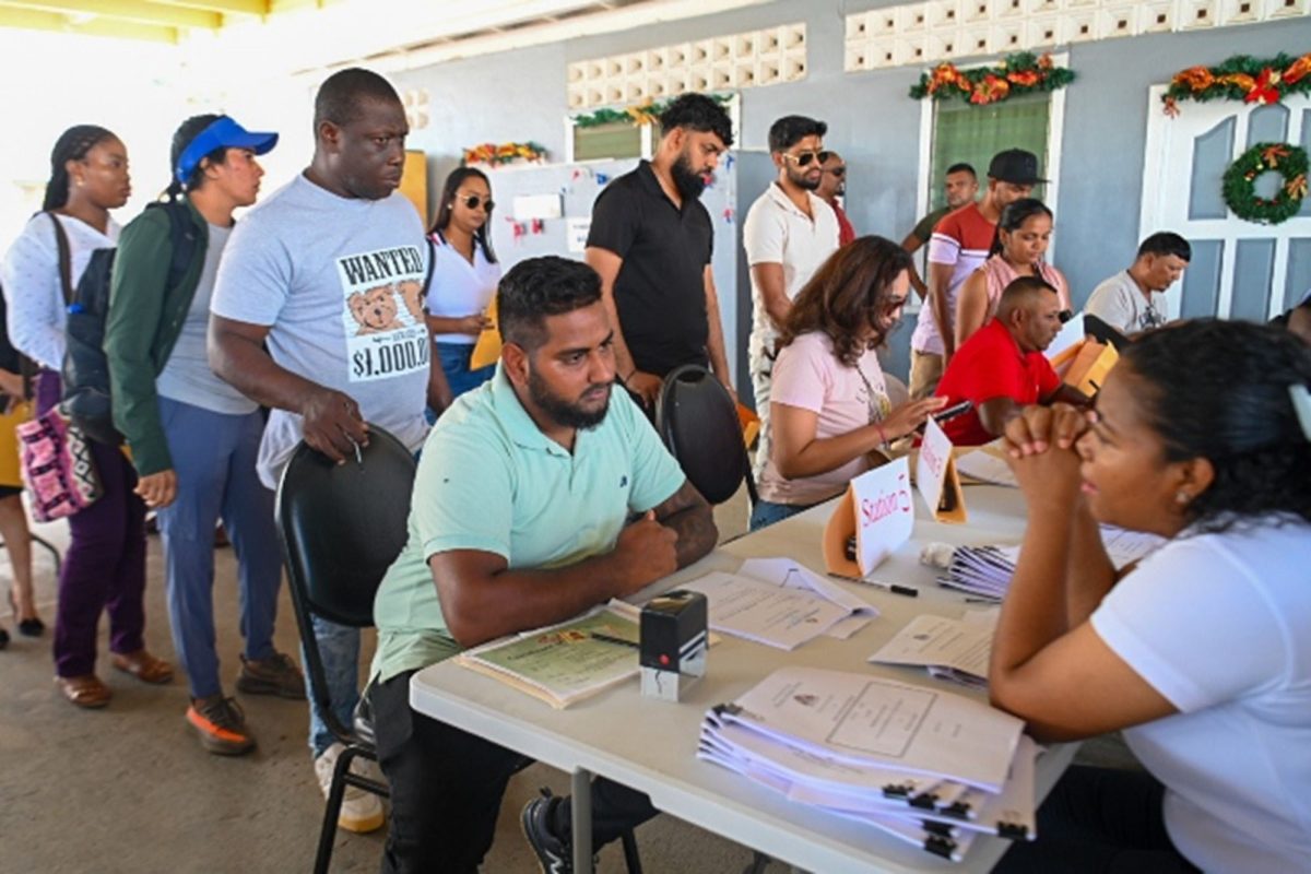 Staff from Ministry of Public Works facilitating the signing of contracts (DPI photo)