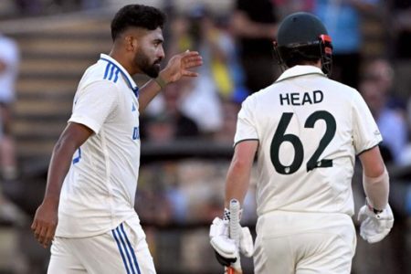 Indian bowler Mohammed Siraj (left) gestures to Australian batsman Travis Head on the second day of the second Test. — AFP
