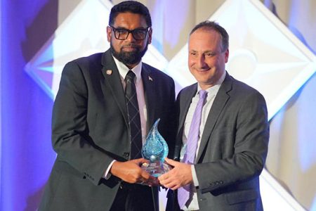 President Irfaan Ali (left) receiving his award. (Office of the President photo)
