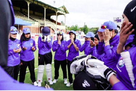 Afghanistan Women's XI players say a prayer
before facing Cricket Without Borders XI at Junction Oval
in Melbourne on Jan 30, 2025. Captain Nahida Sapan said she hoped the charity match would spark "a movement for change". PHOTO: AFP