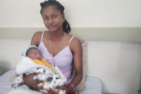 Eleyana Henry with her first-born son Elijah.
