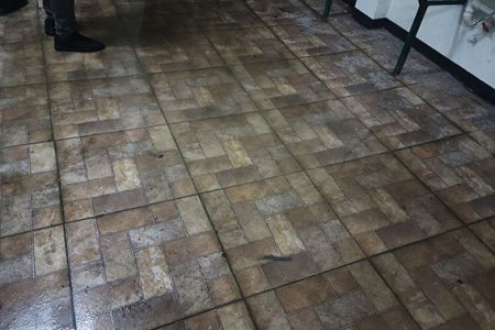 In these photos, water can be seen lodged on the floor of the men’s washroom at the newly renovated Cliff Anderson Sports Hall
