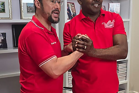 Prime Minister-designate Stuart Young left, and PNM’s General Secretary Foster Cummings clasp hands in unity after hosting a press conference