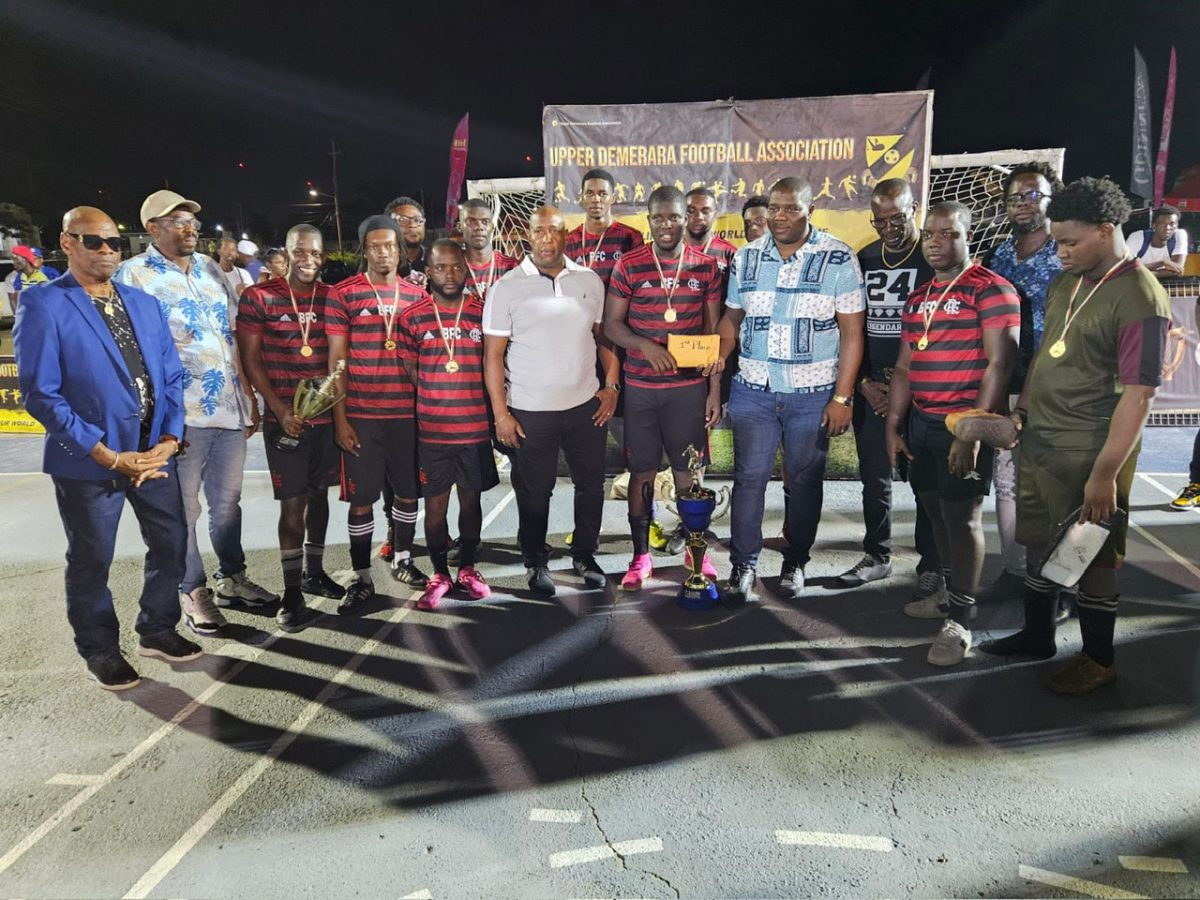 The victorious Botofago unit receives their prize after winning the UDFA Futsal Championship.