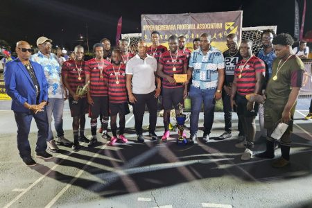 The victorious Botofago unit receives their prize after winning the UDFA Futsal Championship.