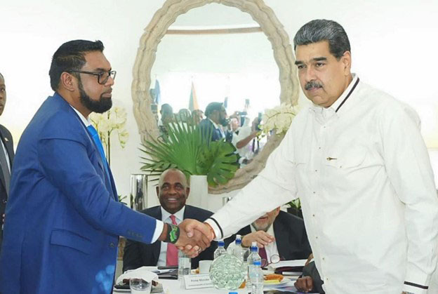 President Irfaan Ali (left) and Venezuelan President Nicolas Maduro shaking hands at one of their meetings that resulted in the signing of Joint Declaration of Argyle for Dialogue and Peace between the two countries in St Vincent in December 2023. (Office of the President photo)