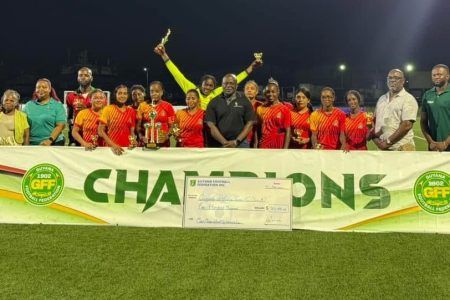 The victorious GDF A unit poses with the first-place prize after winning the inaugural ‘Maid Marian Wheat Up’ Women’s Football Championship