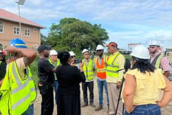 Minister of Public Works Juan Edghill speaking yesterday at the East Bank end of the New Demerara River Bridge at Peters Hall. (Ministry of Public Works photo)