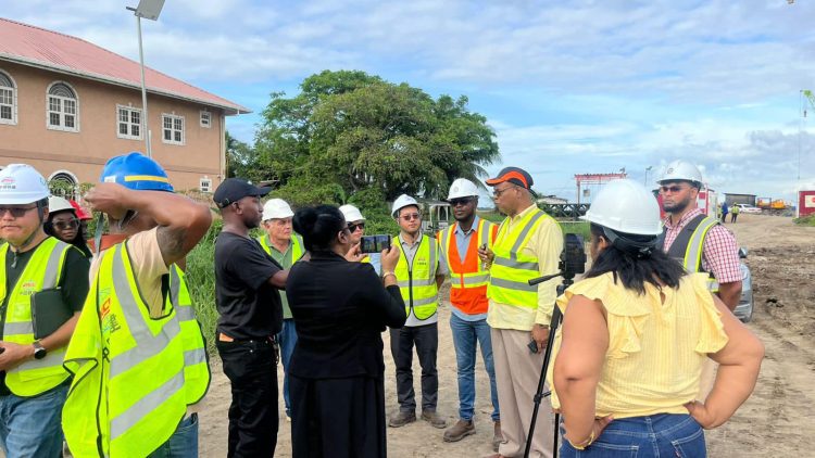 Minister of Public Works Juan Edghill speaking yesterday at the East Bank end of the New Demerara River Bridge at Peters Hall. (Ministry of Public Works photo)