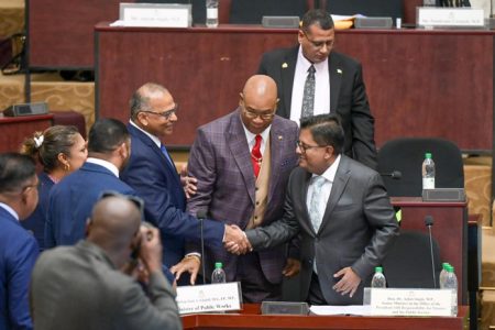 Finance Minister Dr Ashni Singh (right) being congratulated on his budget presentation (Ministry of Finance photo)
