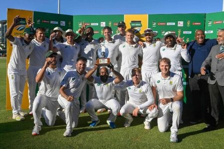 South Africa’s Temba Bavuma (C) holds up the trophy after winning the Test match series, following the fourth day of the second international Test cricket match between South Africa and Pakistan, at Newlands stadium in Cape Town, South Africa on January 6. — AFP