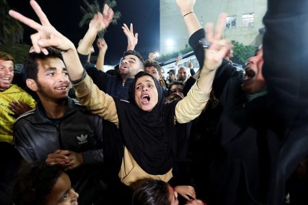 Palestinians react to news on a ceasefire deal with Israel, in Deir Al-Balah in the central Gaza Strip, January 15, 2025. PHOTO: Reuters