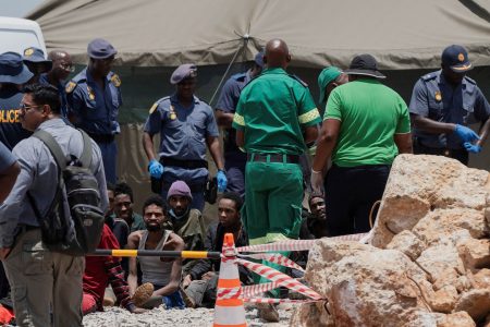 Rescued miners are seen as they are processed by police after being rescued at the mine shaft where rescue operations are ongoing as attempts are made to rescue illegal miners who have been underground for months, in Stilfontein, South Africa, January 14, 2025. REUTERS/Ihsaan Haffejee/File Photo