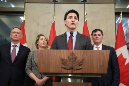 Canada’s Prime Minister Justin Trudeau speaks, flanked by (from L) Minister of Public Safety David McGuinty, Minister of Foreign Affairs Melanie Joly and Minister of Finance and Intergovernmental Affairs Dominic LeBlanc, during a news conference February 1, 2025 on Parliament Hill in Ottawa, Canada. Canada will hit back at US tariffs with 25 percent levies of its own on select American goods, Prime Minister Justin Trudeau said on February 1. “Canada will be responding to the US trade action with 25 percent tariffs against Can$155 billion ($106 billion) worth of American goods,” he said in a dramatic tone as he warned of a fracture in longstanding Canada-US ties. (Photo by Dave Chan / AFP)