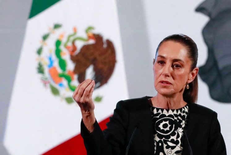 Mexico’s President Claudia Sheinbaum gestures as she speaks about U.S. President Donald Trump’s policies during a press conference at the National Palace, in Mexico City, Mexico January 21, 2025. REUTERS/Henry Romero