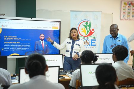 Education Minister Priya Manickchand explaining how the Digital School works (Ministry of Education photo)