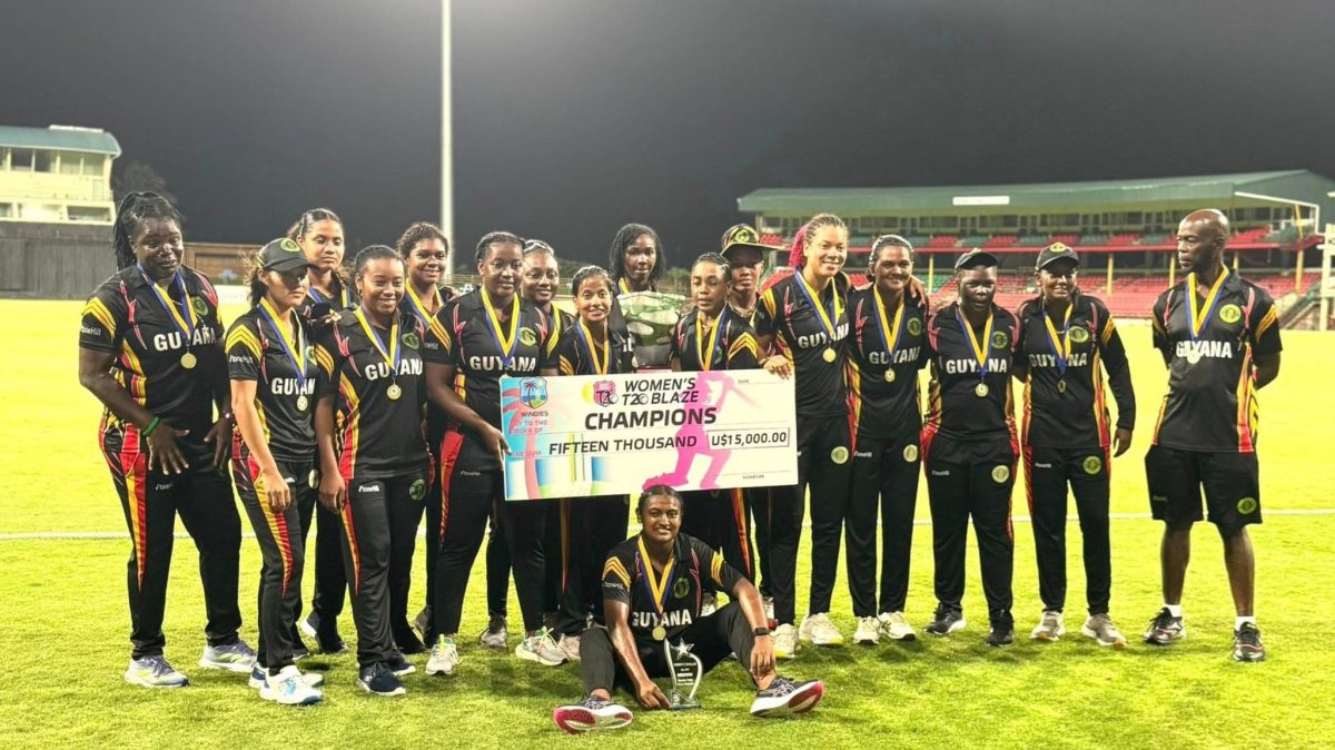 History! The victorious Guyana women’s team posed with the spoils after dethroning Jamaica on Sunday night. 